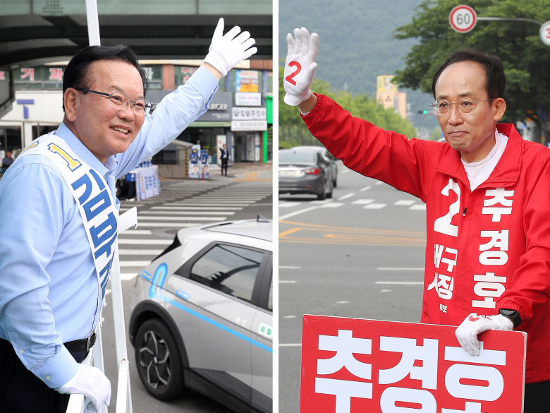 김부겸 더불어민주당 대구시장 후보(왼쪽)가 26일 오전 대구 달서구 상인네거리에서 출근길 시민들을 향해 인사하고 있다. 추경호 국민의힘 대구시장 후보는 같은 날 오전 수성구 두산오거리에서 출근길 시민들을 향해 인사를 하고 있다. 뉴스1